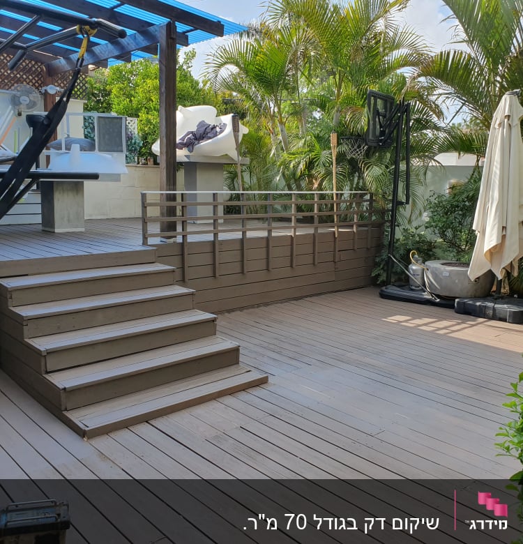 wooden deck with stairs and plants